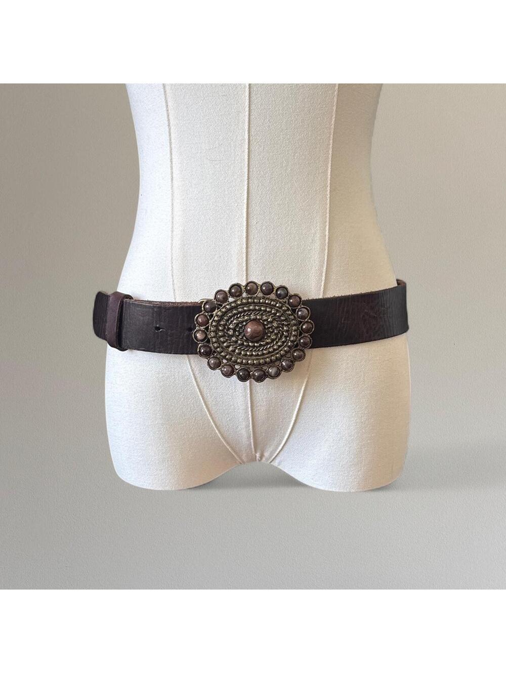 Genuine leather belt with brass buckle.